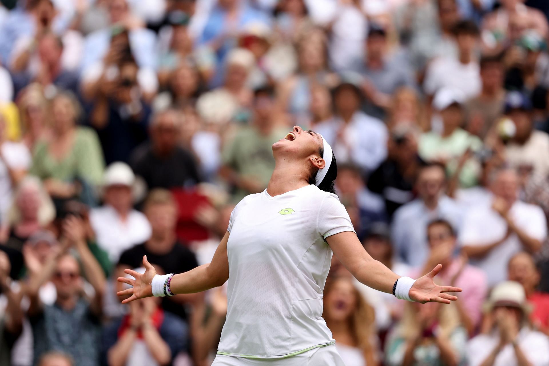 Ons Jabeur celebrating her win over Elena Rybakina at the 2023 Wimbledon Championships.